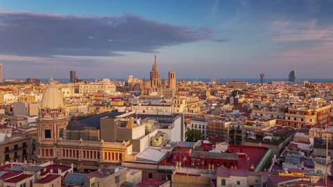 BARCELONA, CATALONIA - JULY 26th 2017: Timelapse of city centre from above rooftop architecture streets point of view