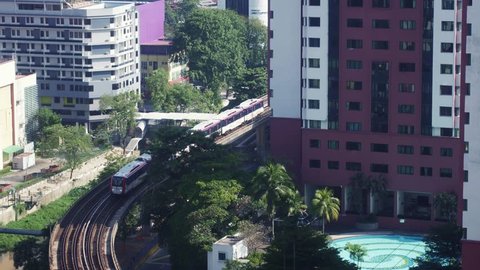 Kuala Lumpur, Malaysia - February 05, 2018: Monorail train rush through the Bukit Bintang intersection in the Golden Triangle area in the heart of Kuala Lumpur in Malaysia capital city.
