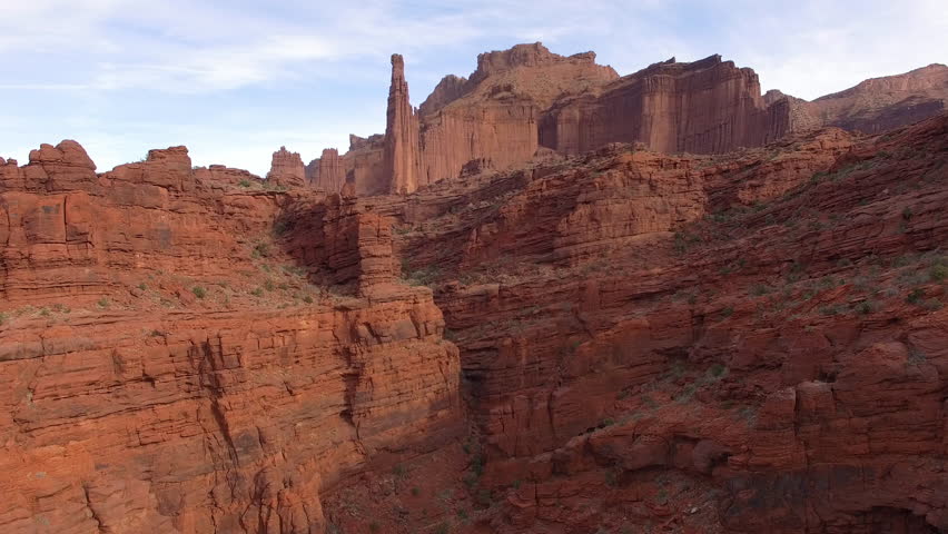 Aerial view of the Fisher Towers through canyon from Onion Creek in the Utah desert near Moab.