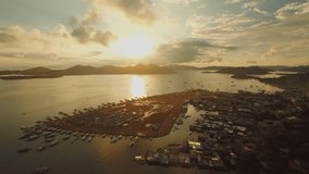 Aerial view Coron city with slums and poor district. Palawan. Busuanga island. Evening time and sunset.