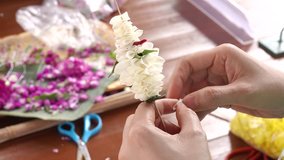 4K Made beautiful wedding garlands in hand woman flower   