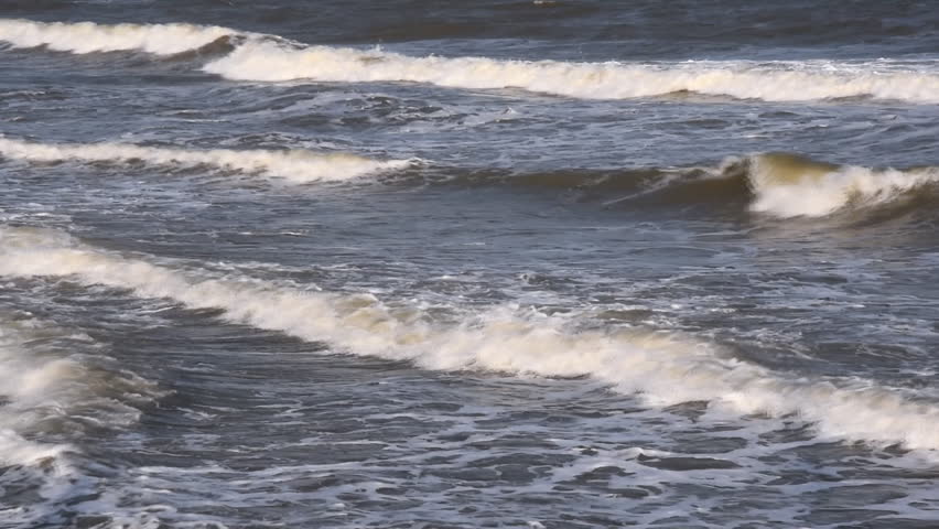 Sea waves go to the shore.