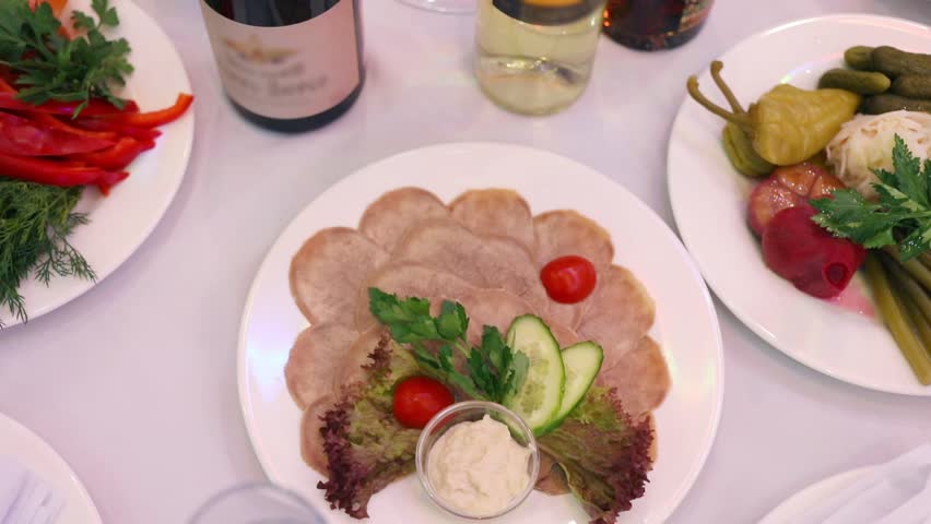 Wine bottles and snacks - serving on table for event, close up