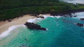 Aerial view of the rock in Waimea Bay, North Shore, Oahu, Hawaii. 4k Drone Video