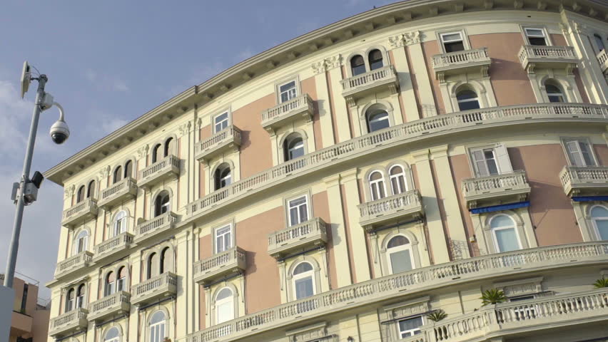 Beautifully designed semicircular building against blue sky, architecture