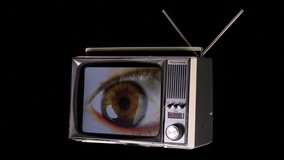 television rotating in space with large eye looking around on the screen with glitch and distortion effects 
