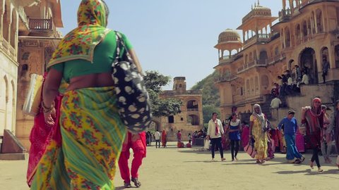 JAIPUR, INDIA - October 2017: Hindu people at Galtaji temple, Jaipur, Rajasthan, India. Slow motion dolly shot. 
