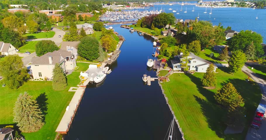 Aerial flyover of Beautiful marinas, canal, waterfront and boats, Sturgeon Bay, Wisconsin.
