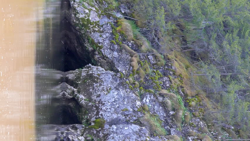 Vertical video. Grotto on the shore River Serga, Urals, Russia