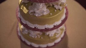 Real time full HD video of a beautiful Wedding Cake.Camera Tilt from bottom to top of the cake (Foreign text means HAPPY NEWLY WEDD)