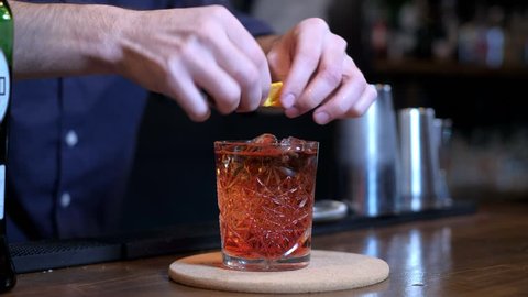 Expert barman is making cocktail at bar 4k
