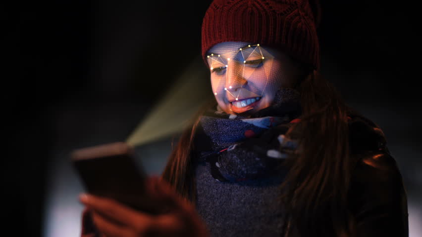 Smartphone using facial recognition system to unlock. A woman face is being scanned as a security measure. Face detection points. Perfect to illustrate: security system, futuristic technology. Royalty-Free Stock Footage #1007436877