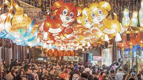 Shanghai, China - Feb. 12, 2018: Lantern Festival in the Chinese New Year( Dog year), high angle view of colorful lanterns and crowded people in Yuyuan Garden at night, 4K version time lapse video.