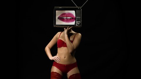 amazing woman in red lingerie dancing and posing with a television as a head. the tv is has video of lips moving
