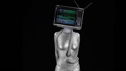 amazing woman painted silver like a robot dancing and posing with a television as a head. the tv has video noise and distortion on it