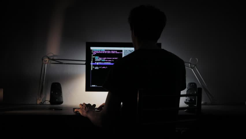 Man working on coputer at night closeup footage