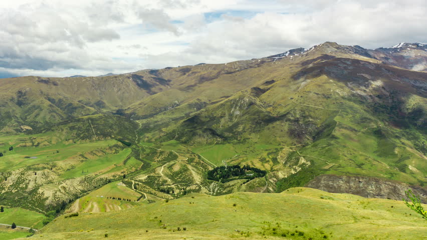 Time lapse of Beautiful New Zealand Mountain Ranges with Moving Clouds Casting Shadows on the Mountain Landscapes in South Island of New Zealand.