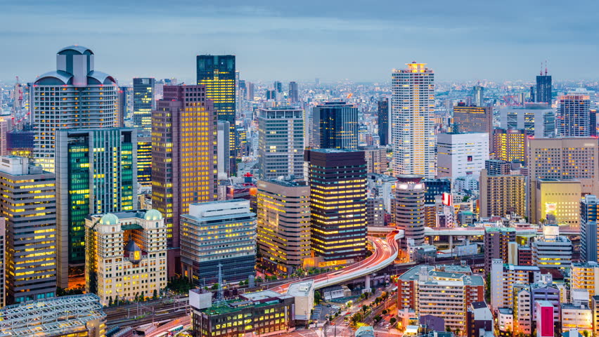 Osaka, Japan city skyline time lapse at dusk.