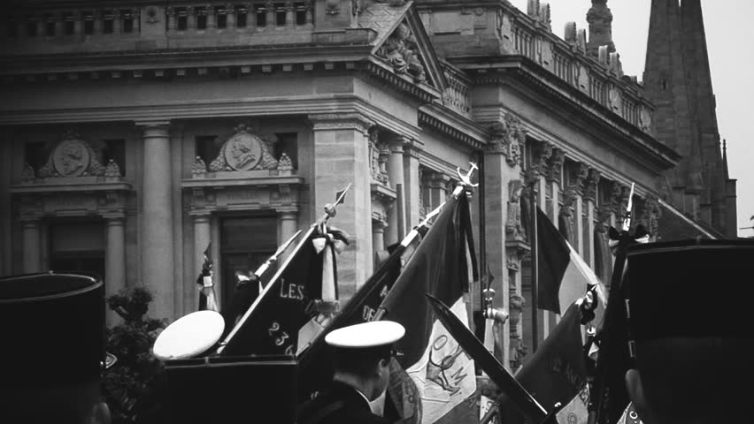 Soldiers holding French flags ceremony to mark Western allies World War Two victory Armistice Europe marking 72nd victory over Nazi Germany 1945 black and white