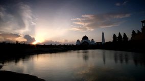4K Time Lapse of evening sunset with reflection surrounding The Strait Mosque of Malacca, Malaysia.