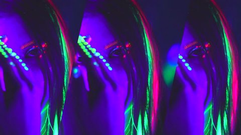 Disco Fashion model woman dancing in neon light, beautiful model girl with fluorescent make-up, Art design of female disco dancer dancing in UV light, colorful make up. Night club, Party. 4K UHD video