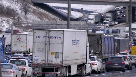 Toronto, Ontario, Canada February 2018 Truck and car gridlock traffic jam on highway in Toronto