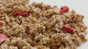 Tasty and crunchy cereals slow pan 4K 2160p 30fps UltraHD footage - Panning over muesli with dehydrated strawberries 3840X2160 UHD video
