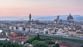 Florence, historic medieval town panorama. Day to night time lapse video transition. Lights switch on. Panning shot
