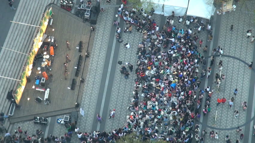Timelapse of crowd of people group relax in Seoul park, aerial view of musical concert