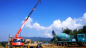Truck Crane and Concrete Mixer Truck at House Construction Site Blurred Background, Asia Laos 4k Video Footage Clip