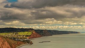 Time-lapse clip of daytime clouds moving over the coastal town and cliffs of Sidmouth, Devon, UK