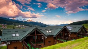 Tourist homes on the slopes. Picturesque and gorgeous scene. Location place Bukovel ski resort, Carpathian, Ukraine Europe. Explore the world's beauty. Time lapse clip, interval shooting.