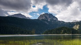 Scenic surroundings of the national park Durmitor. Picturesque scene. Location place Black lake, Montenegro, balkan peninsula Europe. Beauty world. Time lapse clip, interval shooting in HD 1080 video.