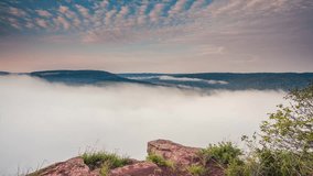 A look at the thick fog over the river in the morning light. Dramatic and gorgeous scene. Location place Dnister canyon, Ukraine, Europe. Time lapse clip, interval shooting in HD 1080 video.