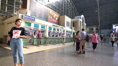 Bangkok, Thailand. January 2018. Some travelers in the waiting room in the main lobby of Hualamphong Railway station 