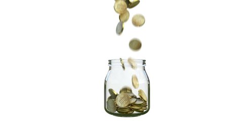coins fill a glass jar