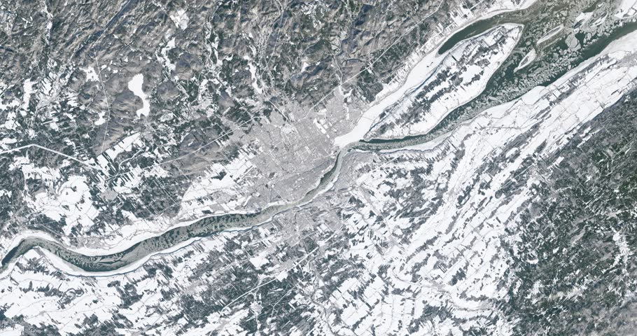 Very high-altitude overflight aerial of St. Lawrence River, Quebec City, Canada, in winter. Clip loops and is reversible. Elements of this image furnished by NASA