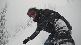 Man Holding Selfie Stick Snowboarding Backcountry Powder