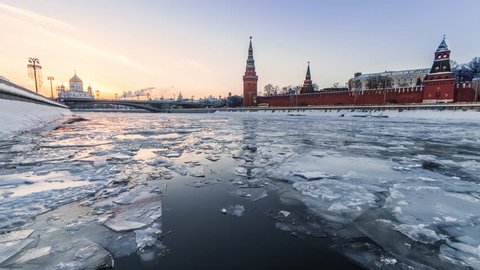 Ice floating on Moskva river in front of Kremlin wall on sunset in Moscow, Russia
