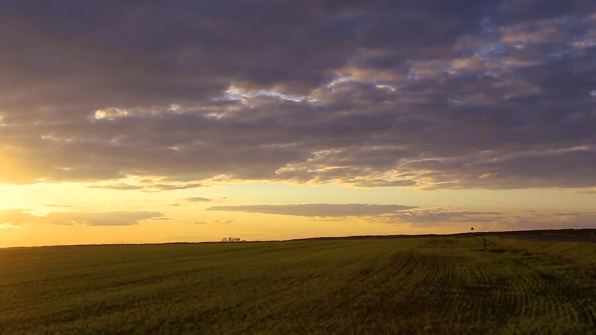 Natural Sunset Sunrise Over Field Or Meadow. Bright Dramatic Sky Over Ground. Countryside Landscape Under Scenic Colorful Sky At Sunset Dawn Sunrise. Skyline, Horizon. Warm Colours.