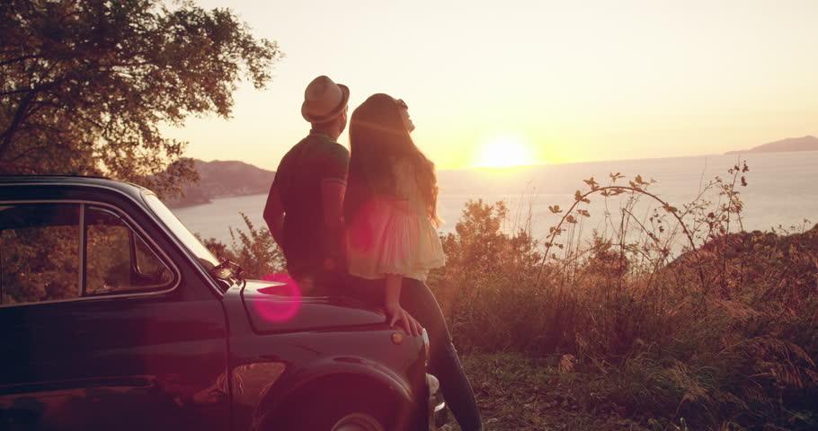 Happy Young Couple On Honeymoon By Old Retro Car Enjoying Sunset Flare Summer Fun Happiness Seeker Action Slow Motion Shot Red Epic 8k Royalty-Free Stock Footage #1007526349