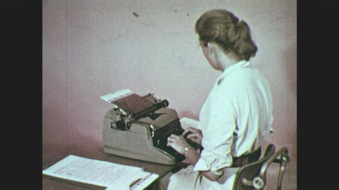 1950s: Woman at typewriter, pulls mimeograph stencil from typewriter, pulls out paper. Woman sits, puts stencil in mimeoscope.