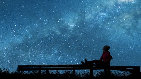 girl watching the stars in night sky