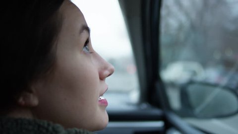 Happy Young Woman Looks With Wonder And Awe At All The Beautiful Sights Of The City From Passenger Side Car Window - Shot On Red Scarlet-W Dragon In 4K/ Slow Motion