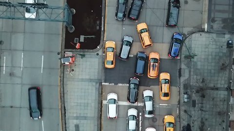 aerial over cars in traffic on Manhattan street zooming out in New York City NYC 1080 HD