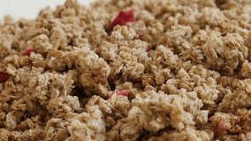 Close-up of high quality crunchy cereals 4K 2160p 30fps UltraHD footage - Panning on muesli with dehydrated strawberries slow pan 3840X2160 UHD video