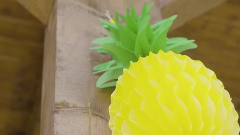 Slow motion summer theme party. Pineapple pinata 