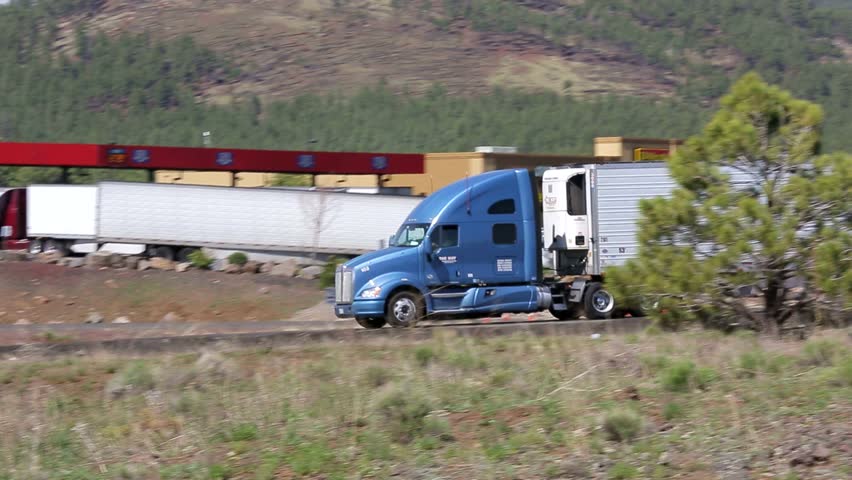 Truck Driving Down Highway Royalty-Free Stock Footage #1007578708