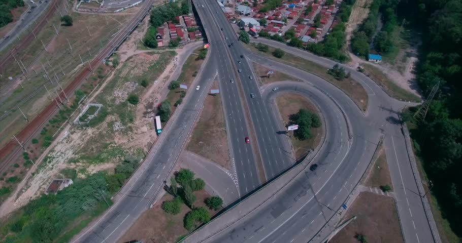 Aerial shot of a The Kiev, Ukraine. Road junction in the area of the metro vydubichi. Highway and overpass with cars and trucks, interchange, road junction in the big city. Top view. 