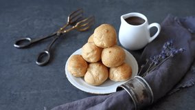 Sweet profiteroles with chocolate and cream. A delicious Frenchman. Video
